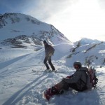 Ski touring with snowboarder